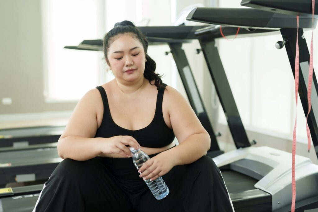overweight woman struggles to lose weight on her own